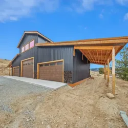 A metal post-frame workshop and house (shouse) built on Colorado terrain